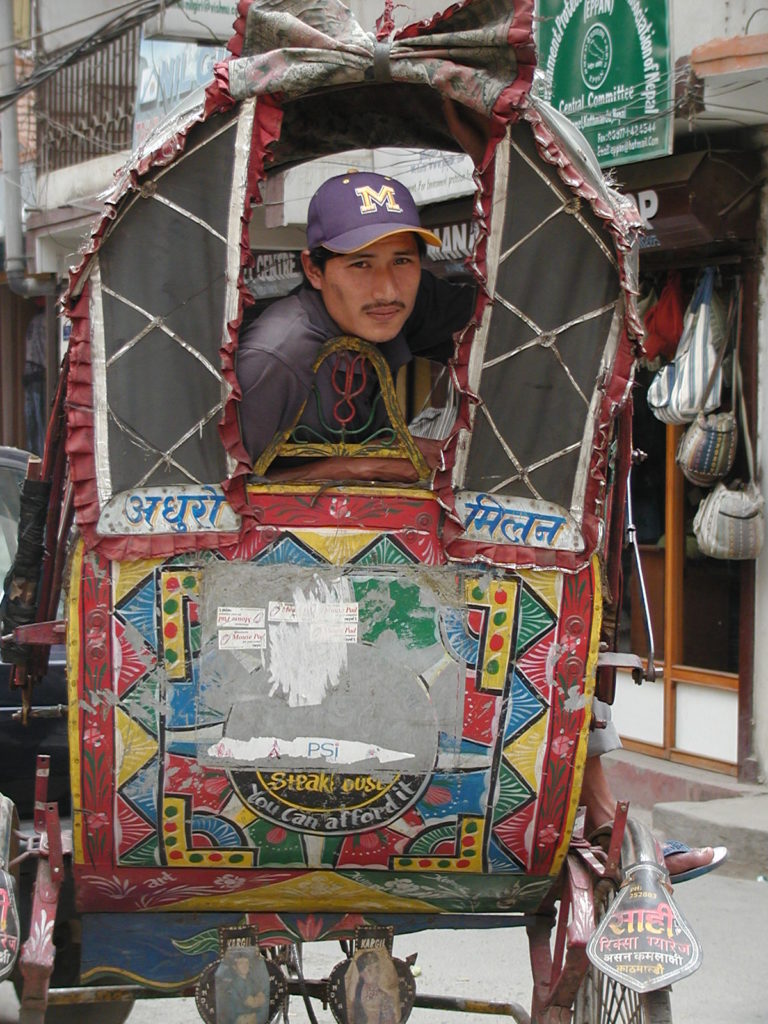 Rikshaw driver waiting for customer