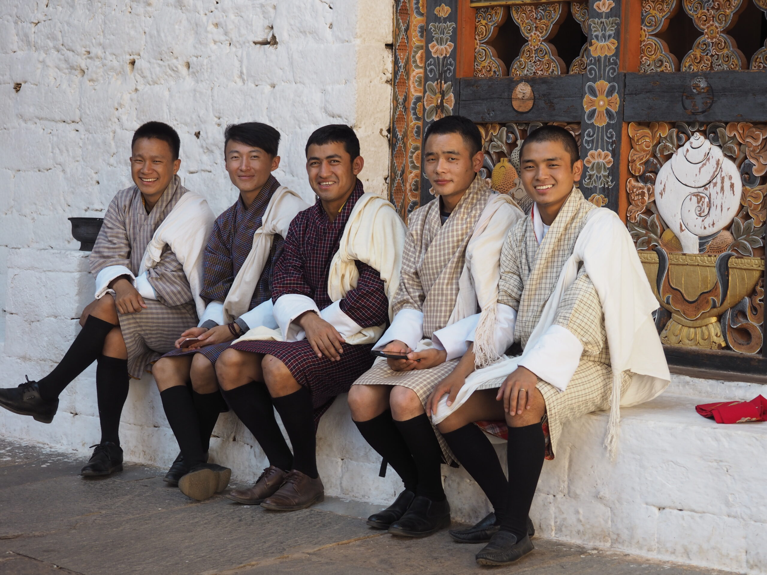 A Bhutanese man dressed in the traditional Bhutanese gho