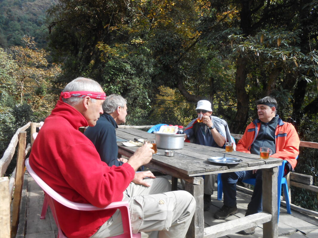 Trekkers having lunch at a teahouse in Nangethanti on the Ghorepani Poon Hill Trek, Nepal.